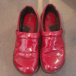Bolo red patent clogs